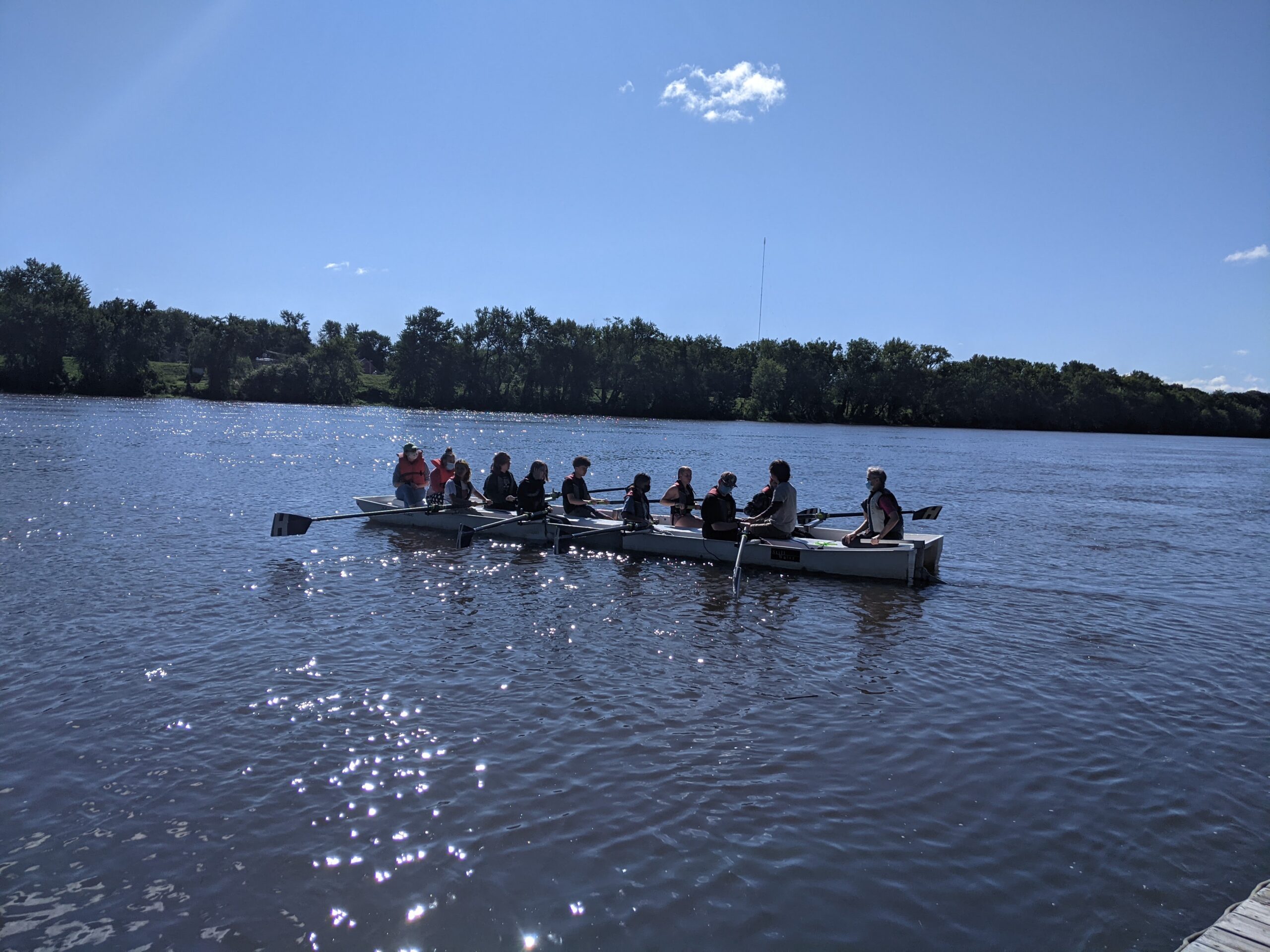 Students rowing on a river