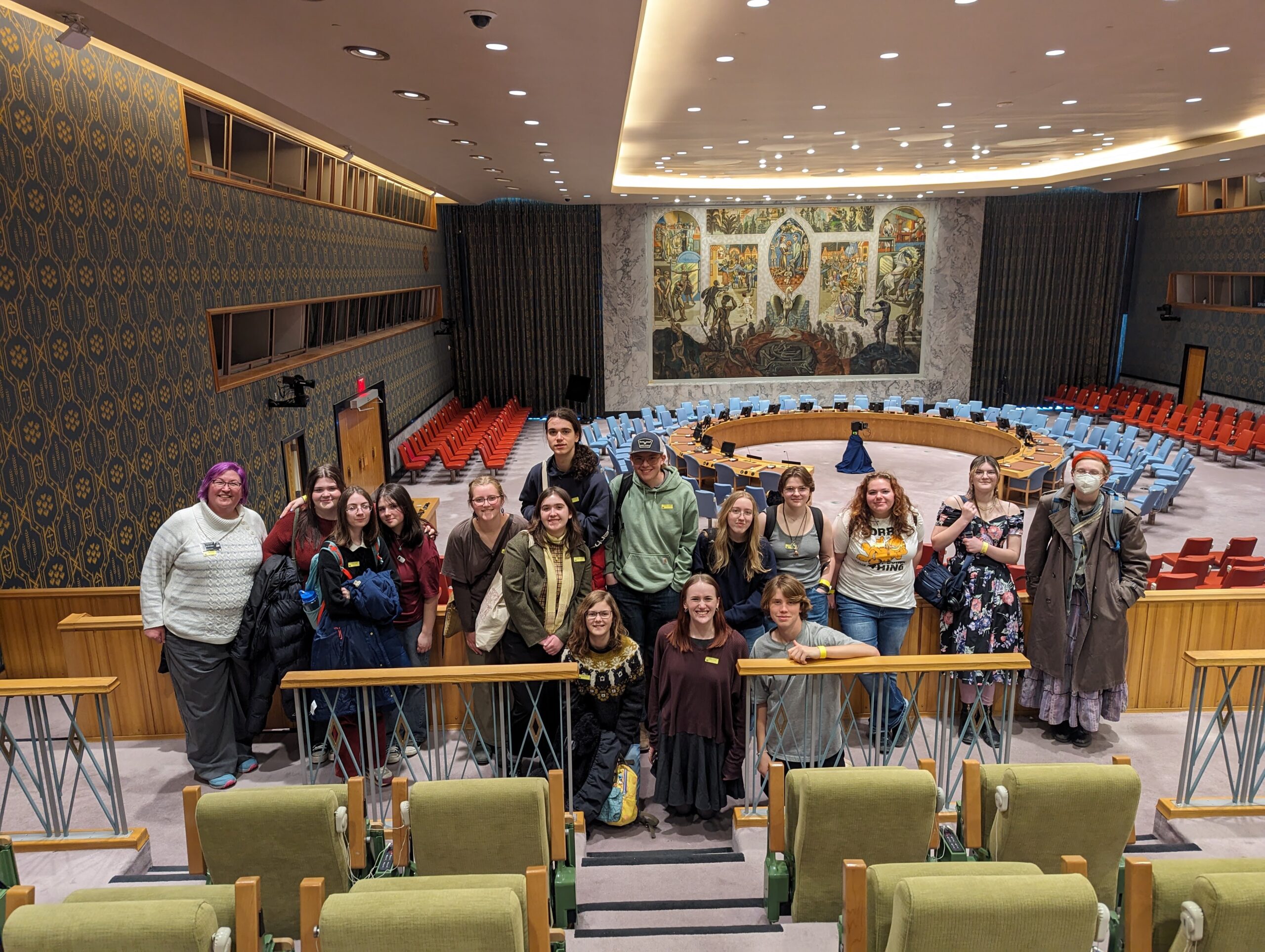 Students gather in a room at the United Nations